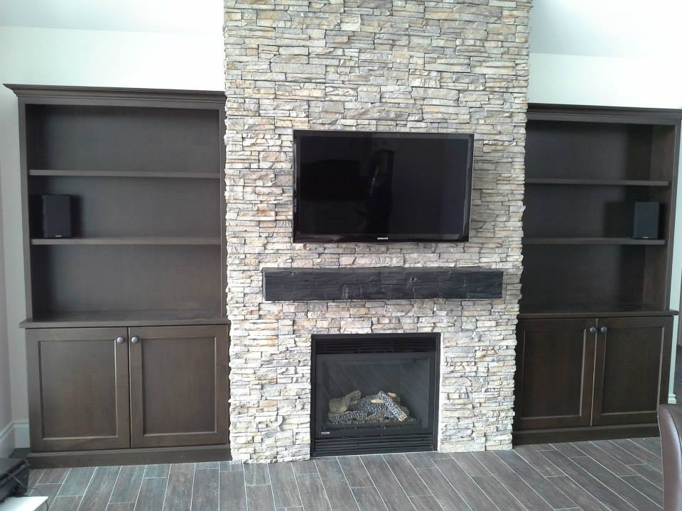 Fireplace mantel and cabinetry by deBoer Cabinets