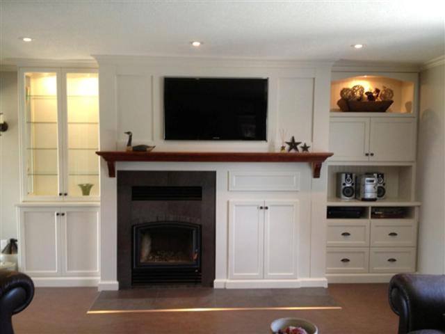 Fireplace mantel and cabinetry by deBoer Cabinets