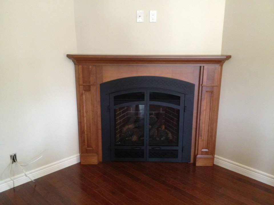 Fireplace mantel and cabinetry by deBoer Cabinets