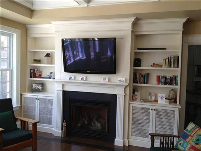 Fireplace mantel and cabinetry by deBoer Cabinets