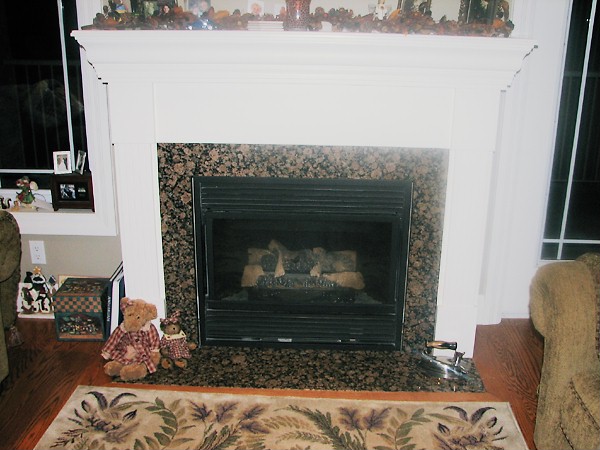 Fireplace mantel and cabinetry by deBoer Cabinets