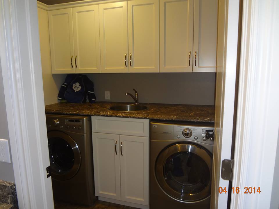 Laundry room cabinetry by deBoer Cabinets