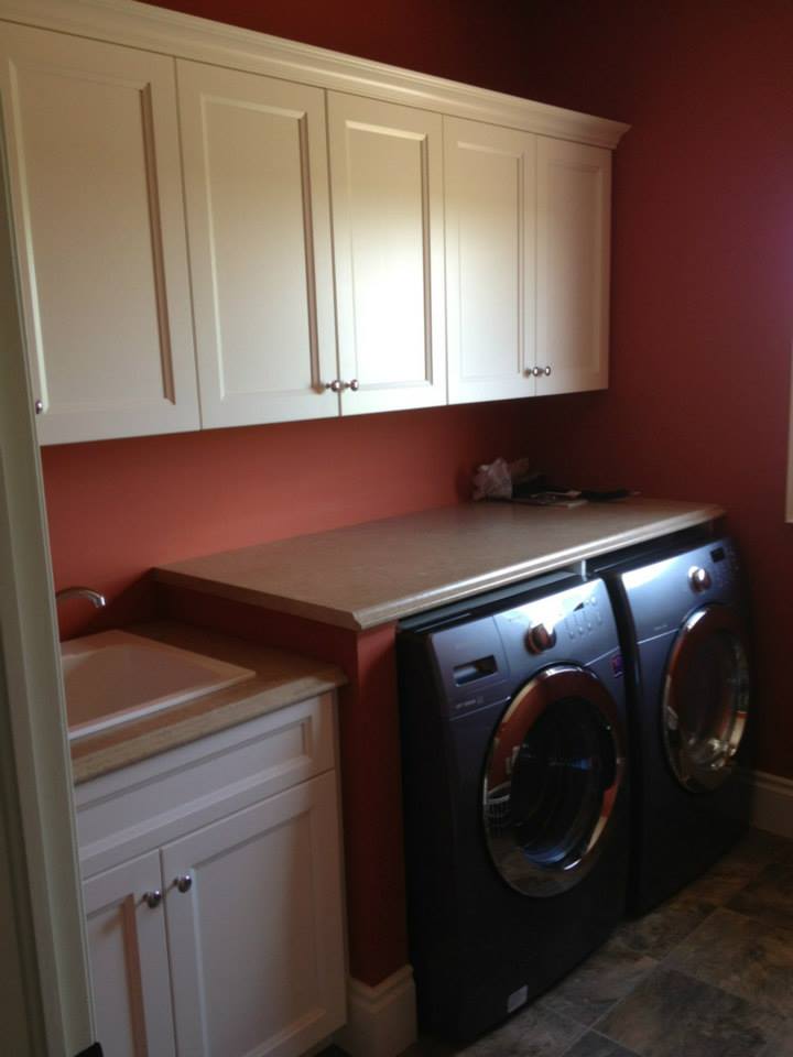 Laundry room cabinetry by deBoer Cabinets